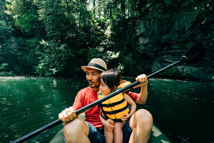 Father and his toddler girl kayaking together, Saitama, Japan